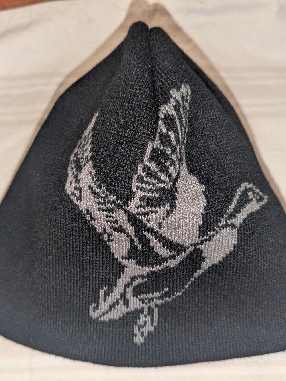 Dri-Duck Black Knit Beanie with Grey Flying Bird Motif